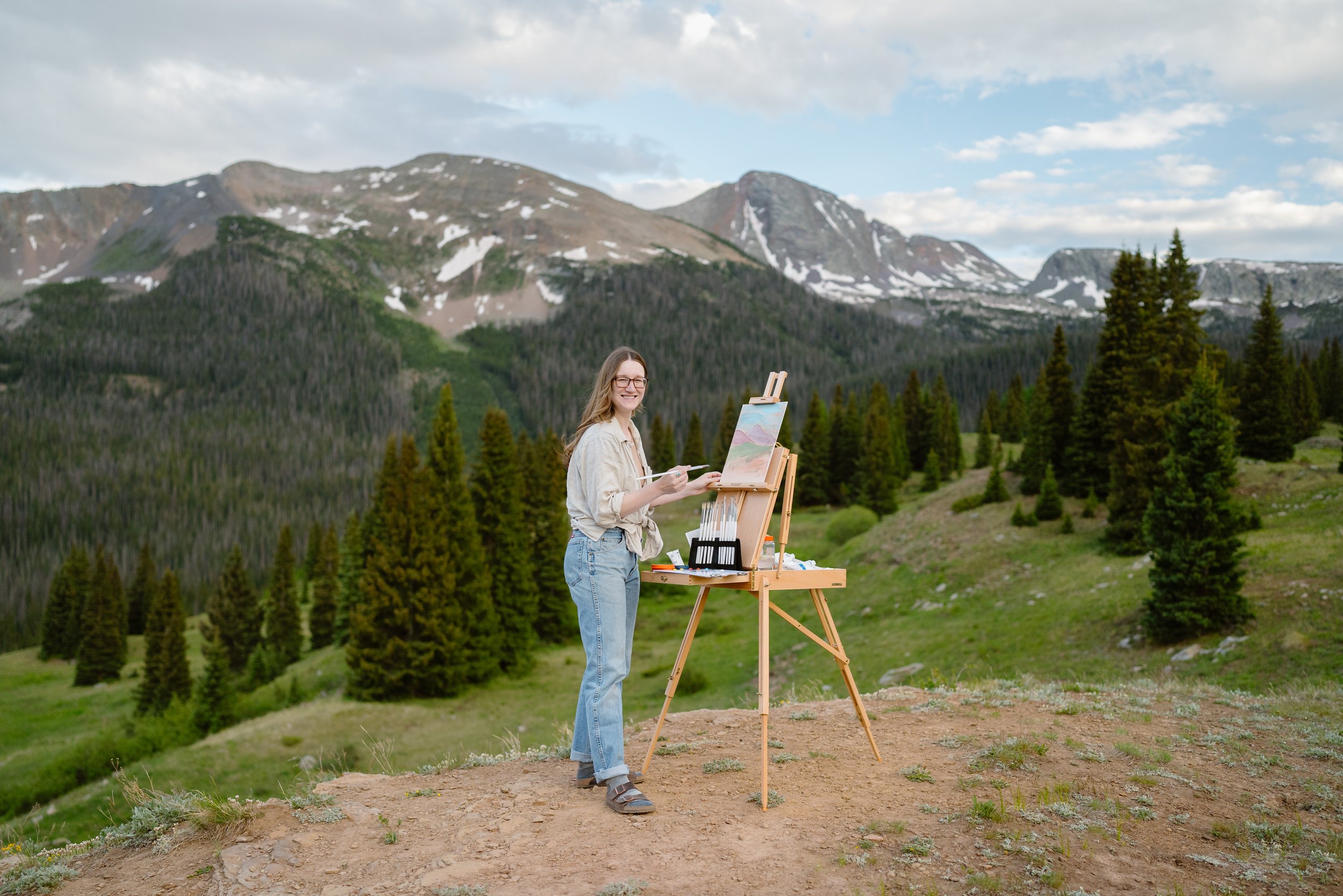 Jaclyn painting at her easel
